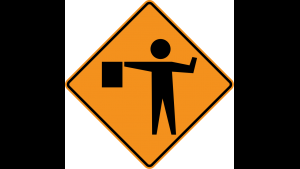 Flagger in Road Ahead sign