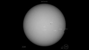 Solar image with sunspots annotated